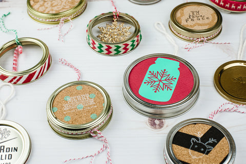 various DIY Christmas ornaments made from used mason jar flat lids and ring and scrapbooking paper