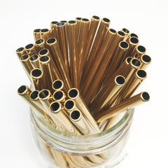 metallic gold stainless steel reusable straws in a mason jar