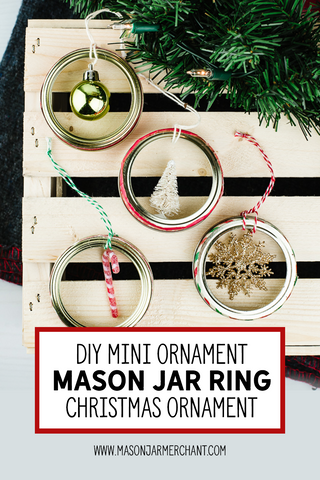 diy mini ornament mason jar ring Christmas ornaments on a wooden crate next to an evergreen bow