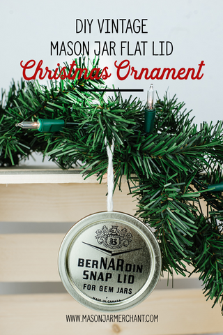 handmade vintage Bernardin GEM jar mason jar flat lid Christmas ornament handing from an evergreen bough
