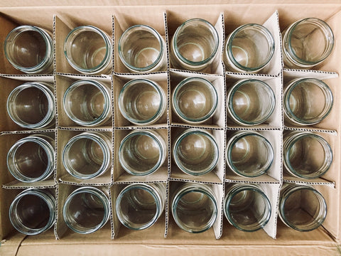 a box of empty mason jars