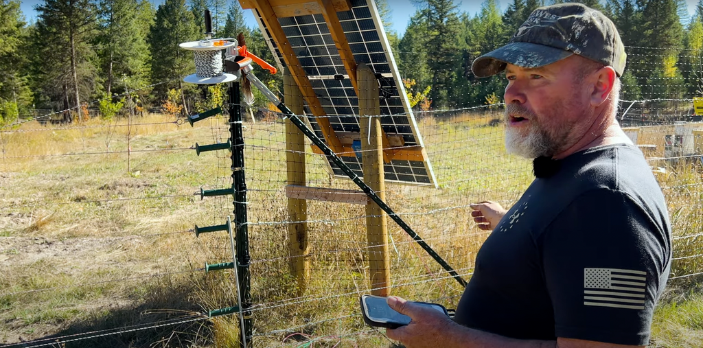 An electric fence protects Marty’s newly planted orchard and beehives from curious grizzly bears.