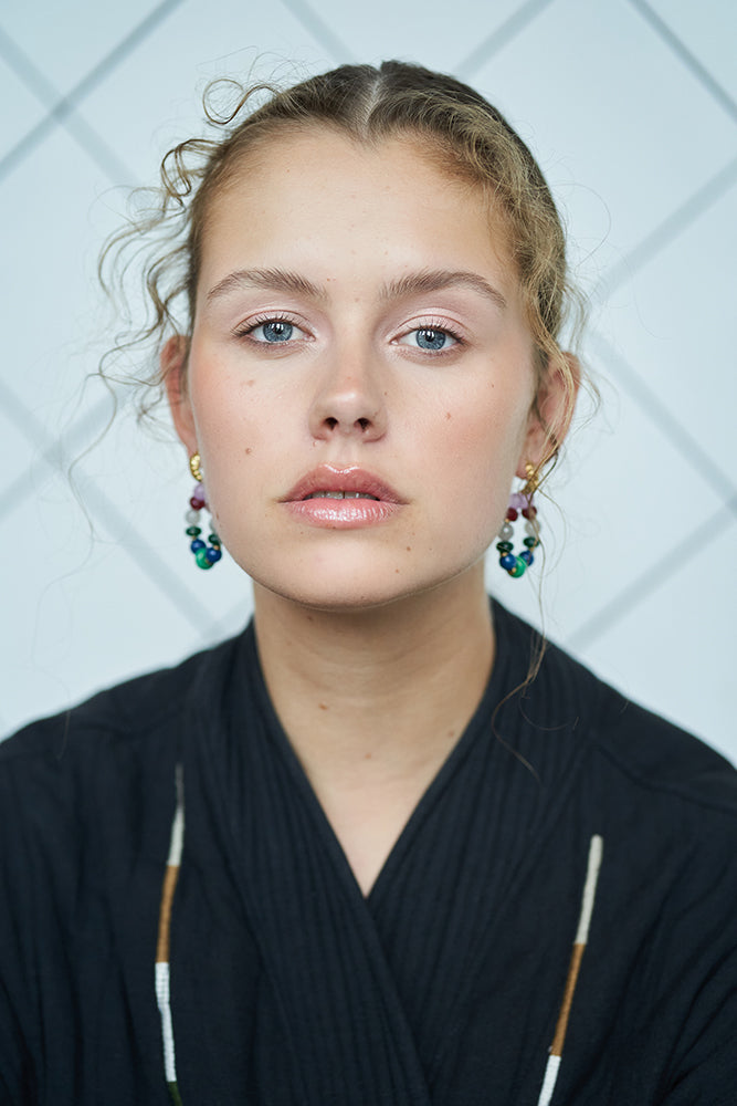 model photo with beaded earrings