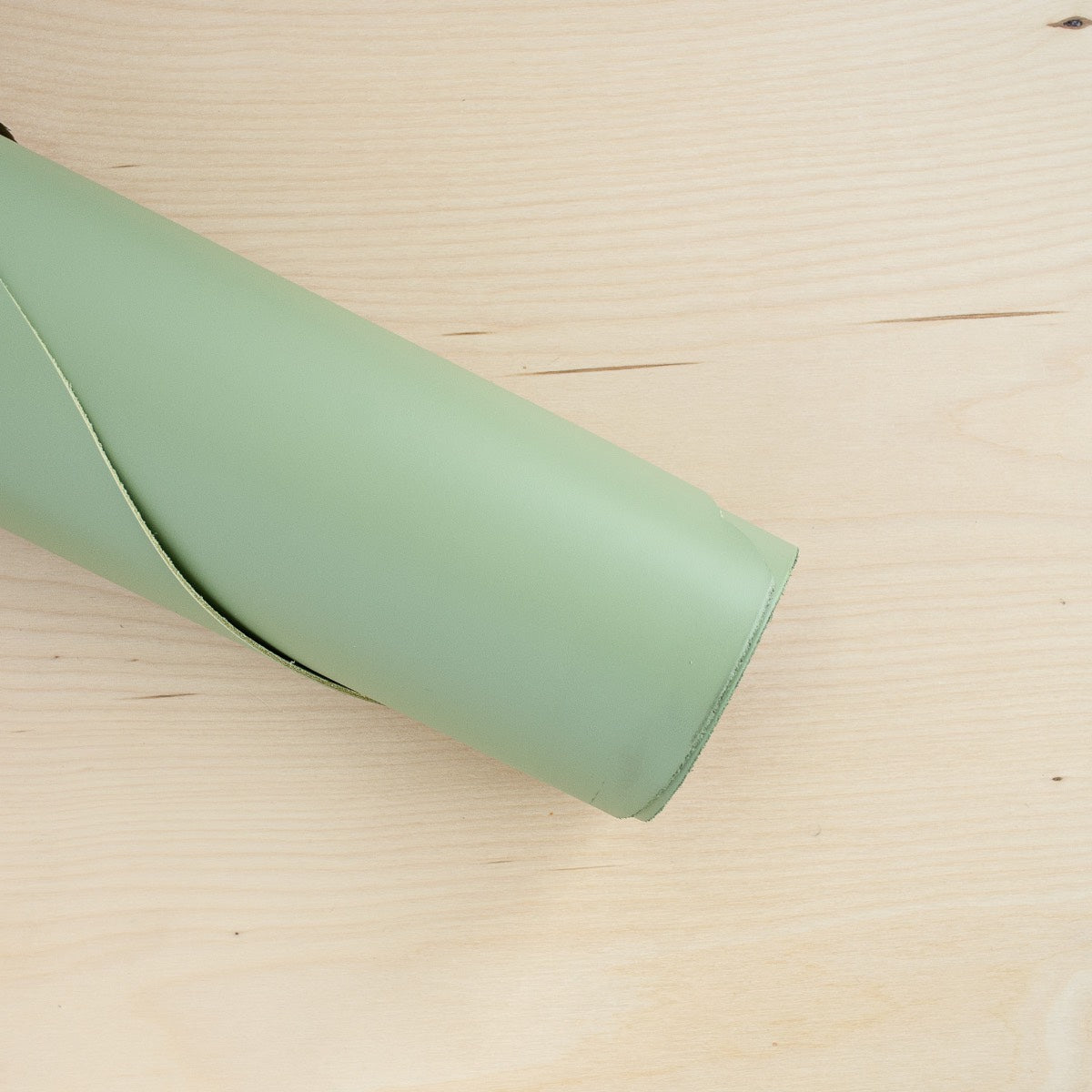 Sage green leather on a roll for sage green clutch bags.