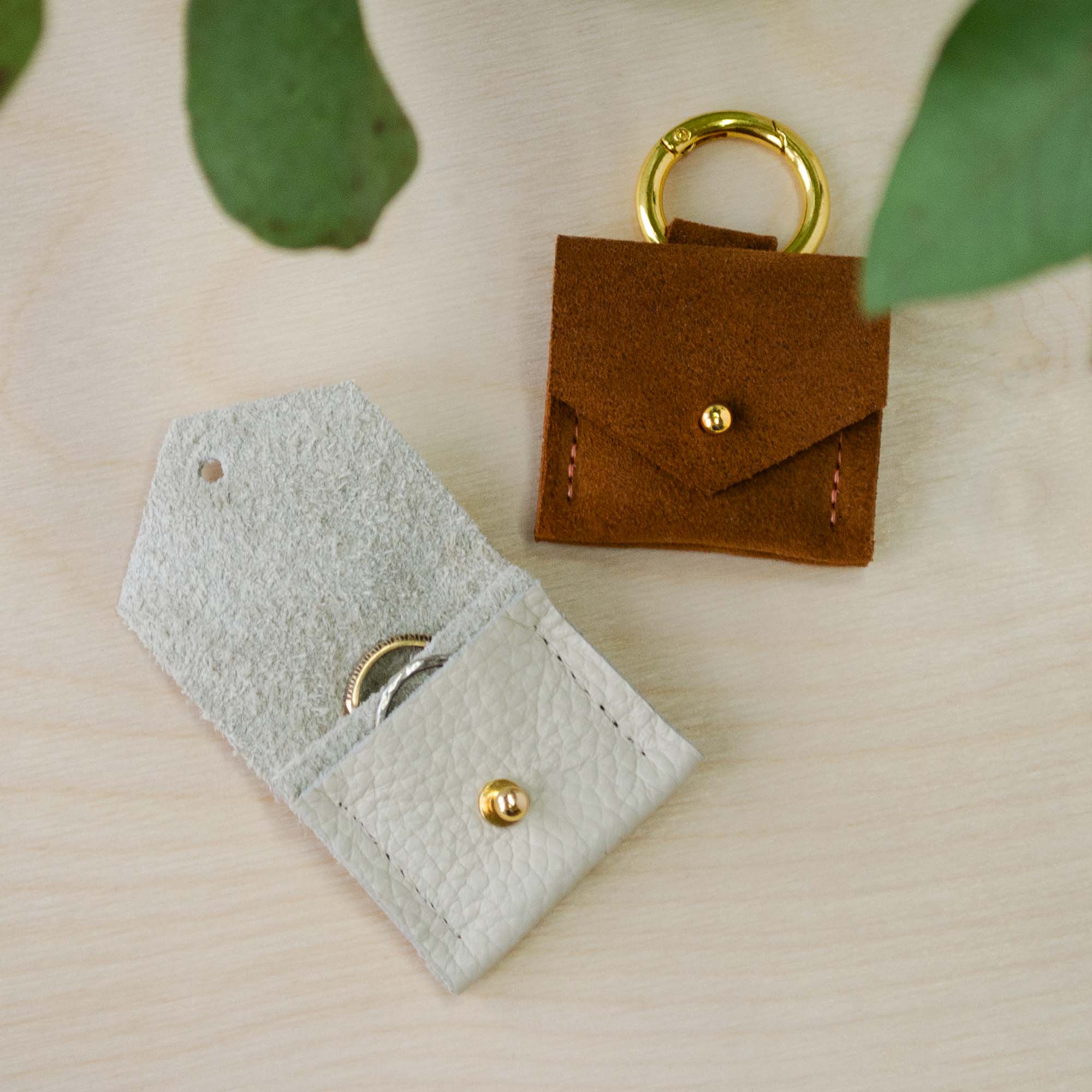 Dog wedding ring bearer pouch in cream and tan, inside the pouch there are two slots for two wedding bands.