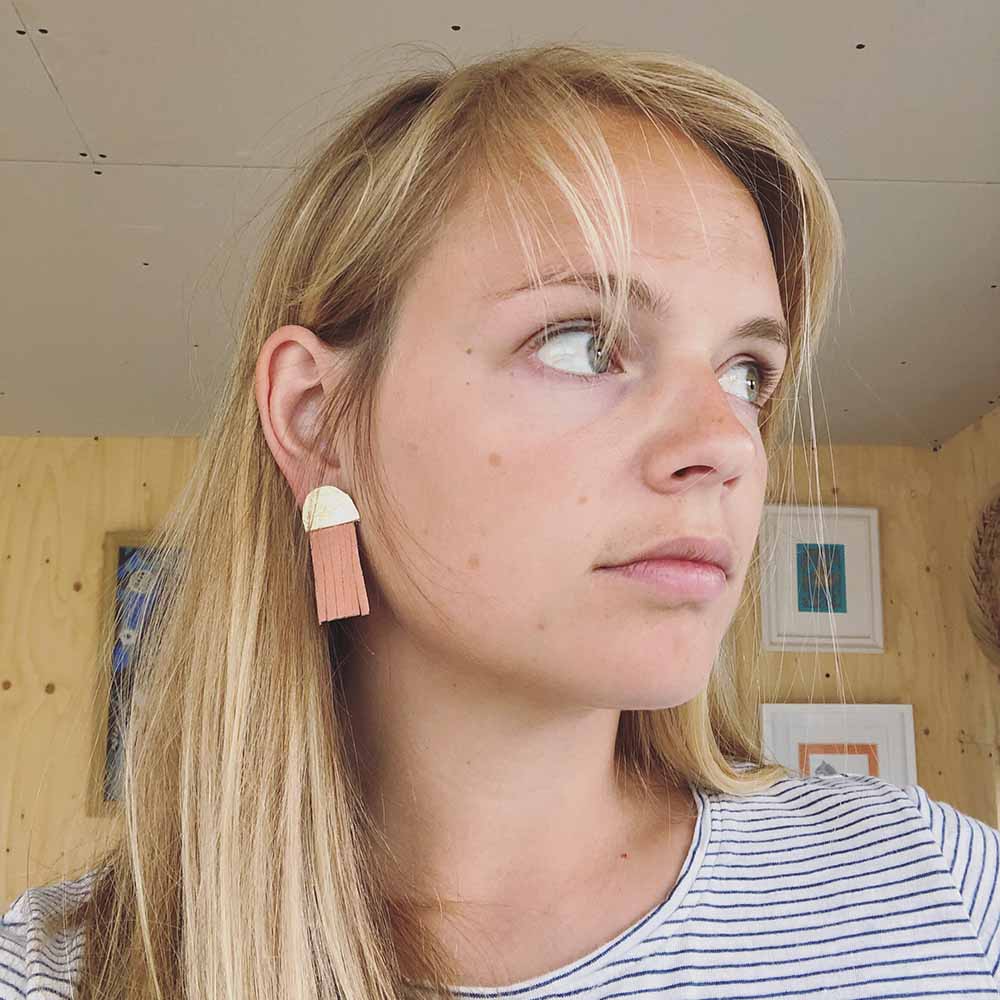 Woman Wearing Leather Dangle Earrings