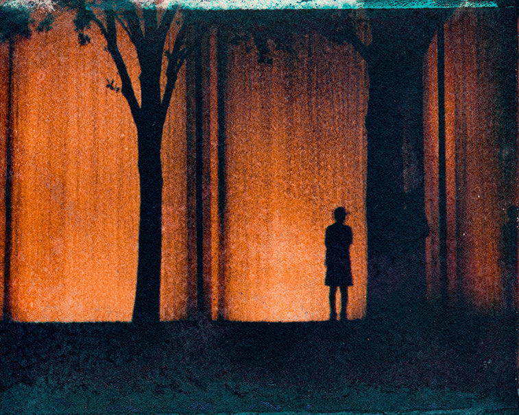 Polaroid transfer of silhouette  of man and two trees with urban waterfall in the background