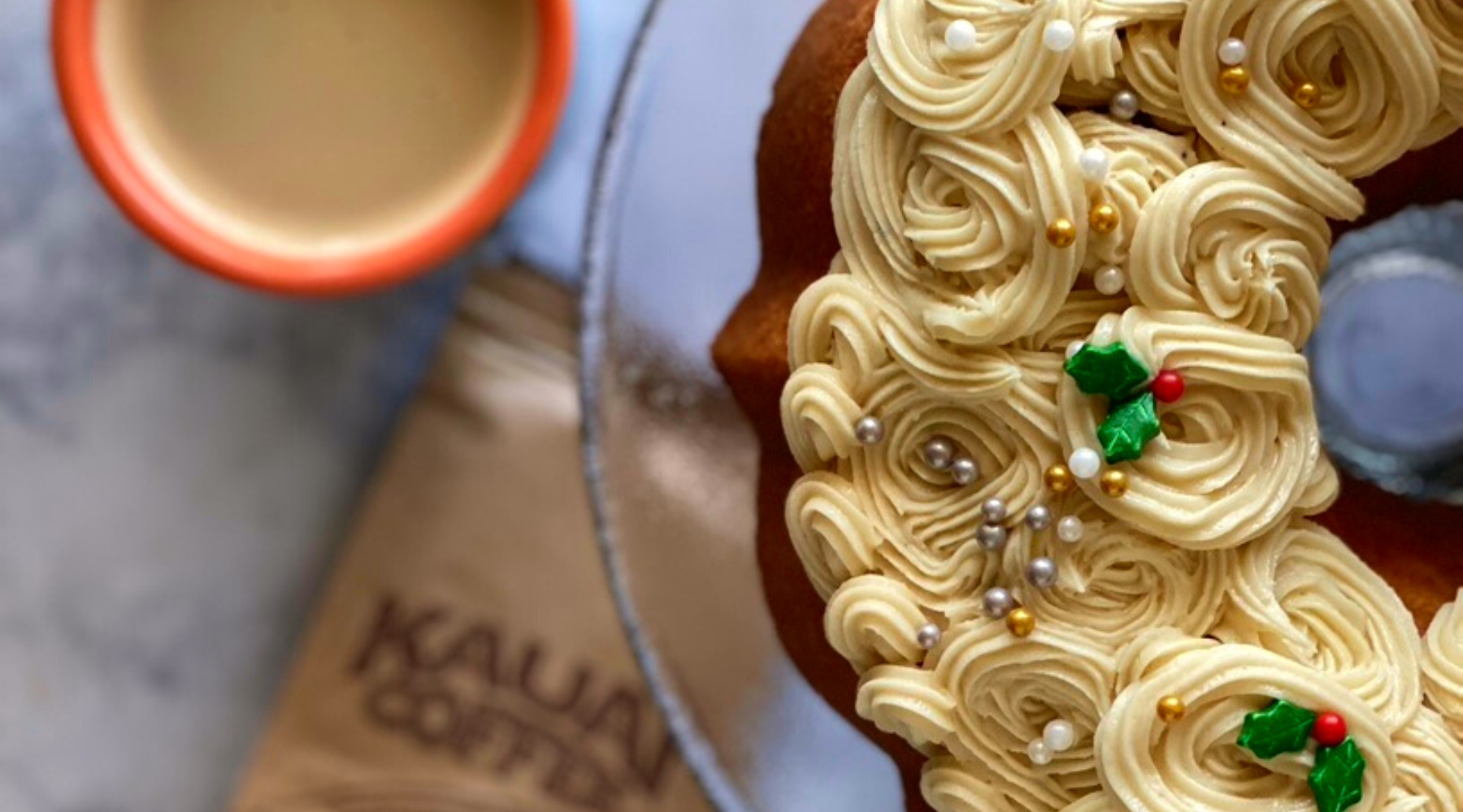 A close up shot of an elaborately decorated eggnog latte bundt cake made with Kauai Coffee