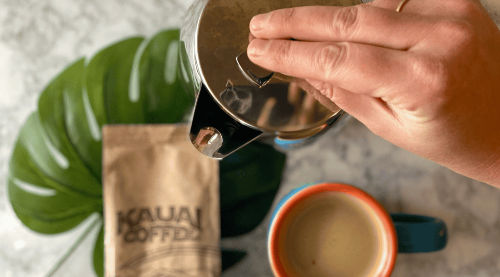 french press and a kauai coffee bag