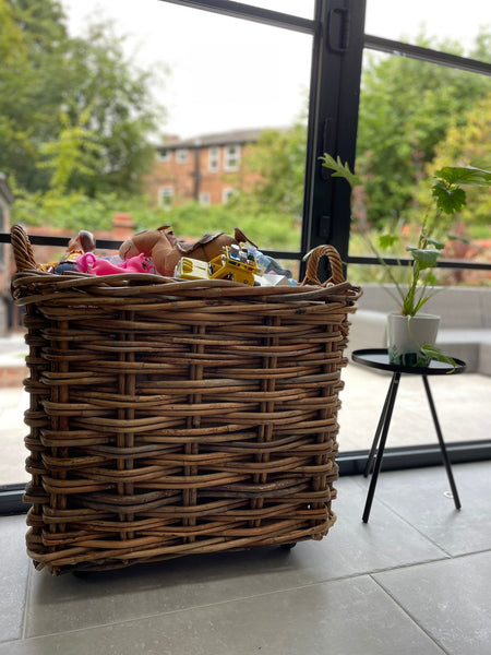 Wovenhill wicker log basket filled with childrens toys