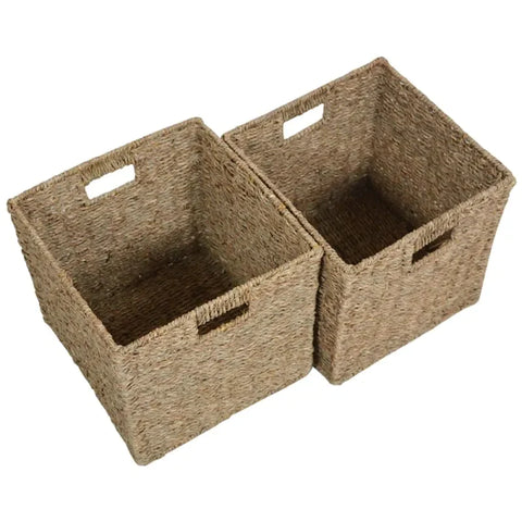 A set of two brown seagrass wicker baskets on a white background. The baskets are square with hole handles on either side. 