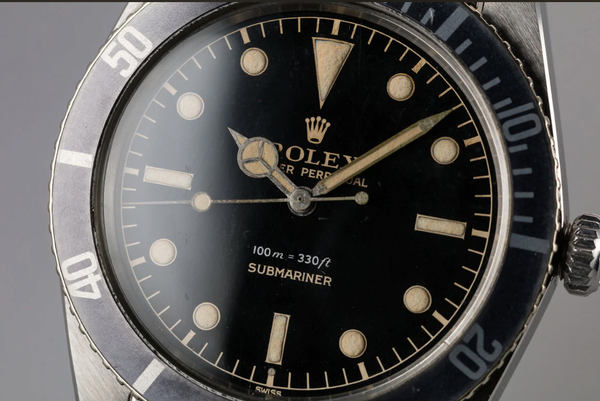 Rolex 3rd generation Submariner dot image at 6 o'clock