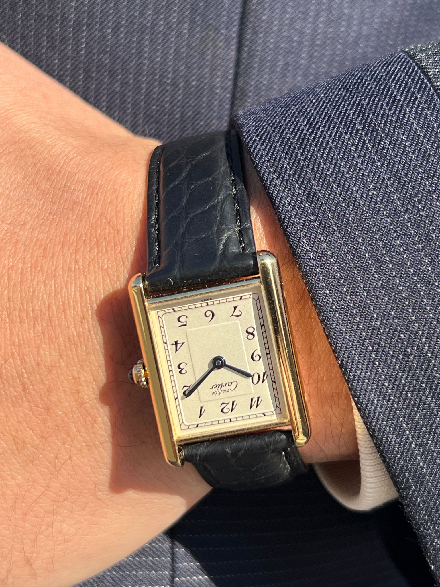 Discontinued Cartier Must Tank with Breguet index. Actual photo of the watch being worn.
