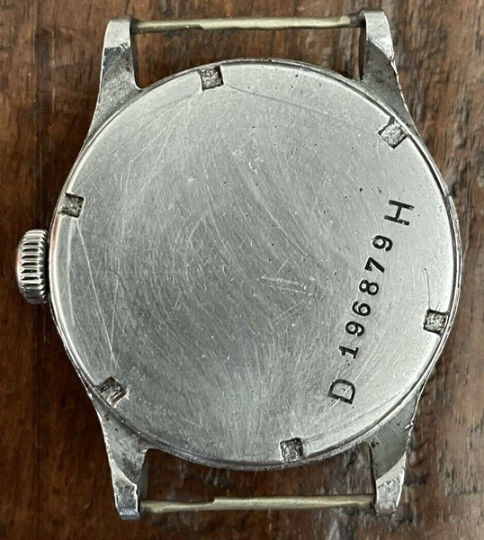 The "DH" engraved on the back of a review sports watch used by the German Army