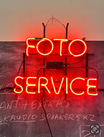 Neon Red "FOTO SERVICE" sign located in Crockett California