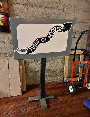Freestanding hand painted "Tubes of Mystery" sign