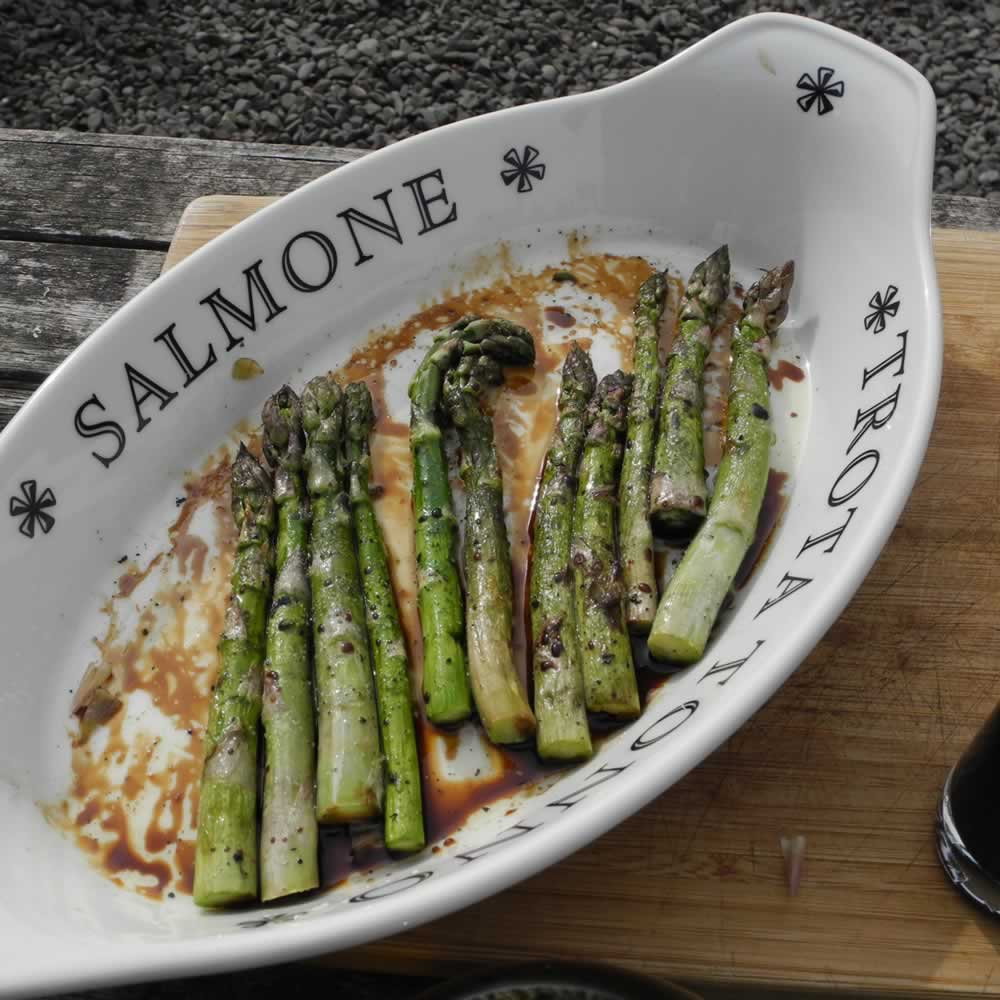 Scorched BBQ Asparagus coated with Olive Oil and Balsamic Vinegar and ready for eating!