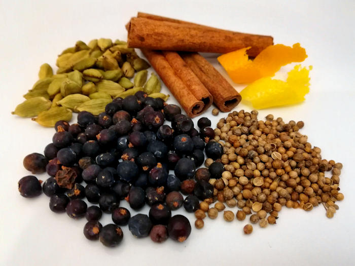 Juniper Berries, Cardamon Pods, Cassia Bark (Cinnamon), Lemon Peel, Orange Peel and Coriander Seeds