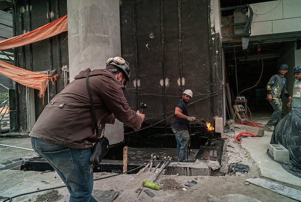 Fernando taking pictures of the workers