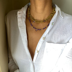 Purple Amethyst and Brass Heliotrope Wrap as necklace on model with white shirt 