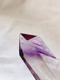 amethyst crystal point with a touch of purple