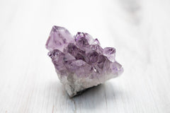 rough purple amethyst stone with crystal points