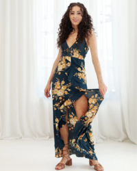 Flaunt this frilly high-low maxi with camisole straps, a tie-back top, a front slit, and navy and gold floral beauty - you'll slay any event!