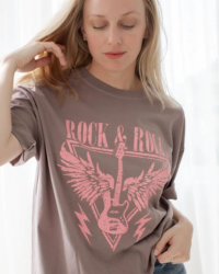 Stay on beat in style with this Rock & Roll Graphic Tee! Made of 100% cotton, it's the perfect classic fit for any rockstar. And with its bold pink graphic, you'll be sure to make a statement no matter how you rock it!  100% Cotton