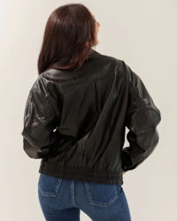 Stay stylish and eco-friendly with this classic Vegan Leather Bomber Jacket. This modern iteration features a classic bomber silhouette, side pockets, and banded bottom collar. Its vegan leather fabric is soft and lightweight for a comfortable wear. Slightly oversized fit