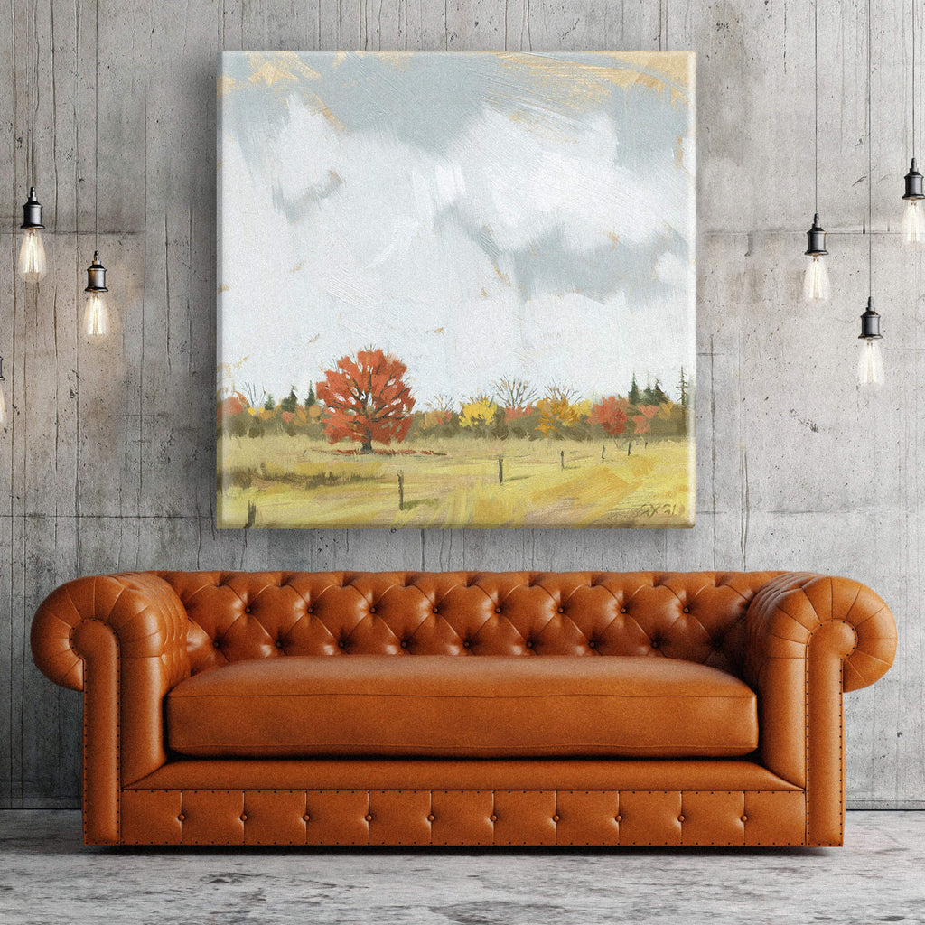 Painted fall landscape hung above couch