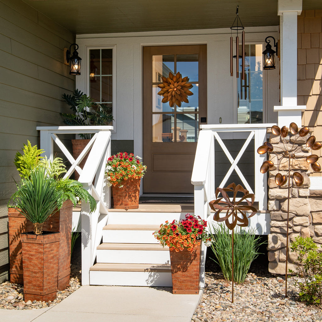 Large planters on steps of front porch