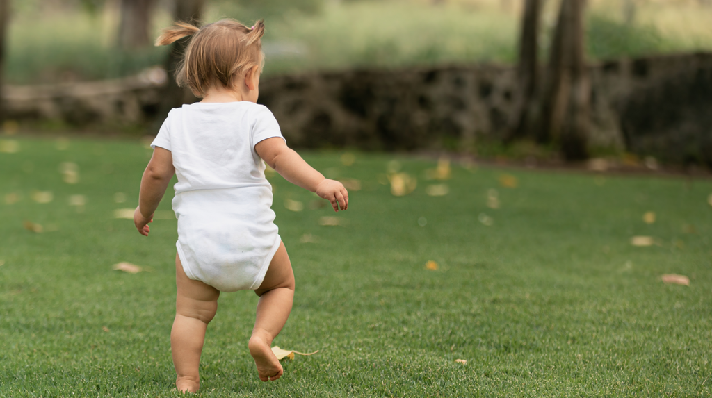 baby taking their first steps