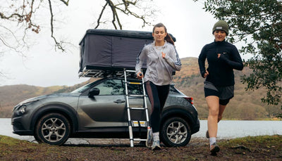 Two women starting an outdoor run after setting up their TentBox Classic