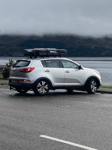 TentBox Lite mounted on car, parked near lake