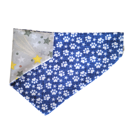 double sided Bandana for dogs.  Fits onto dog collar.  5 sizes. x-small, small, medium, large, x-large. 1 side is blue with white pawprints and the other is grey with stars