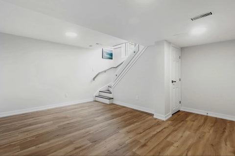 empty basement room with hardwood floors