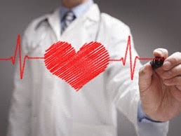 Doctor drawing a heart with heartbeat lines on a clear board