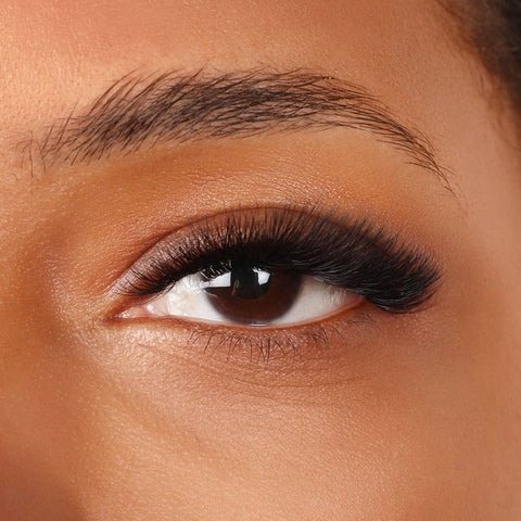 Role of a Lash Technician with classic lashes and volume lashes