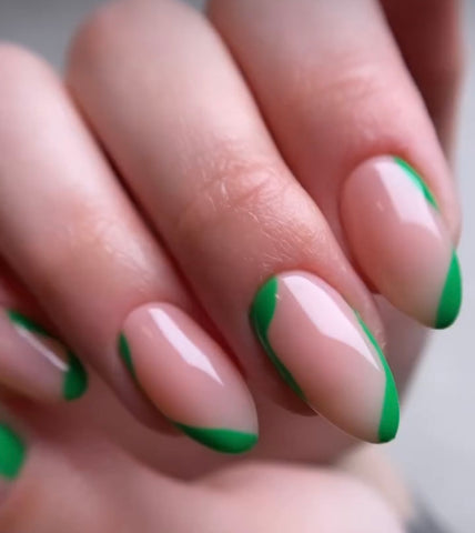 Green nail art with French tips
