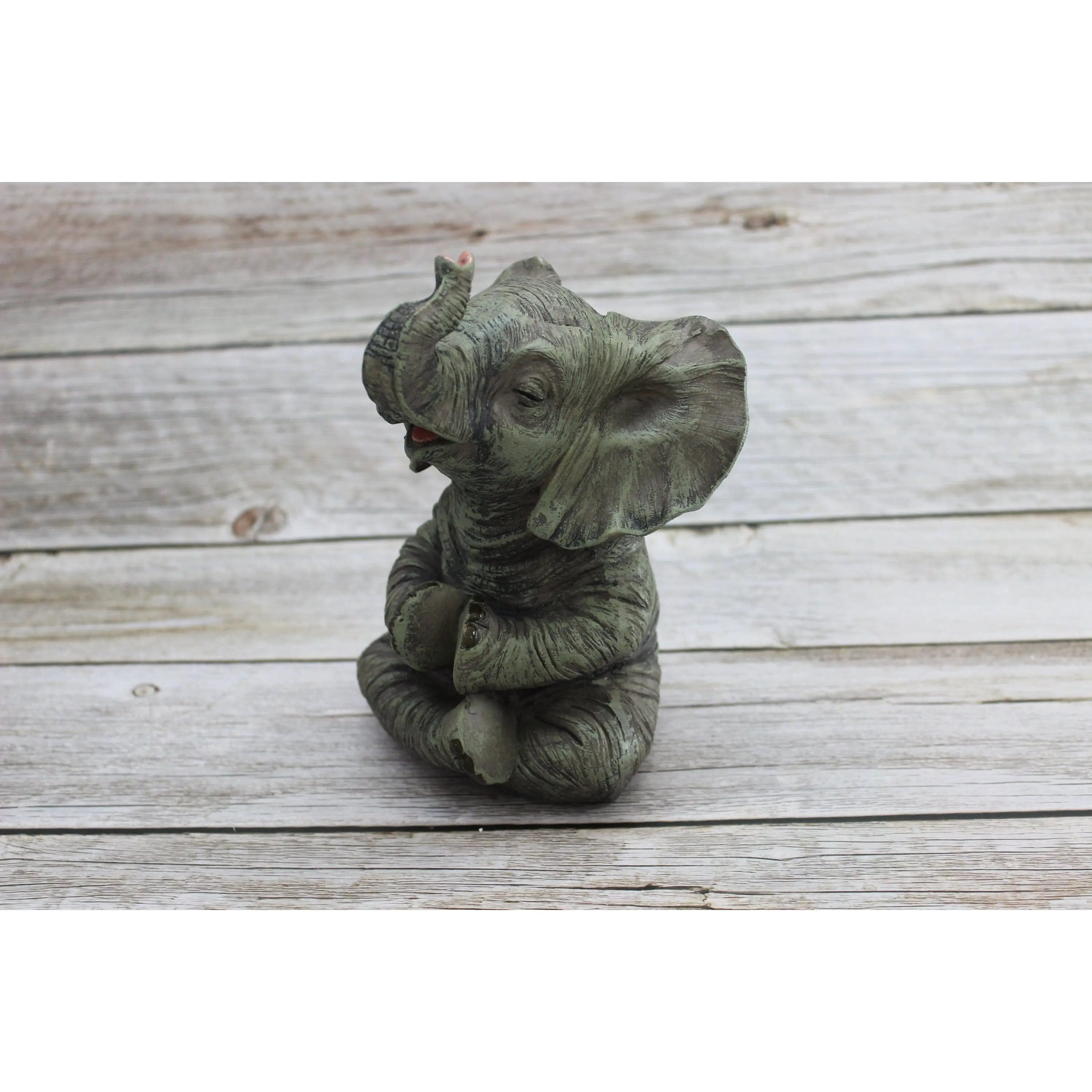 Yoga meditating elephant statue