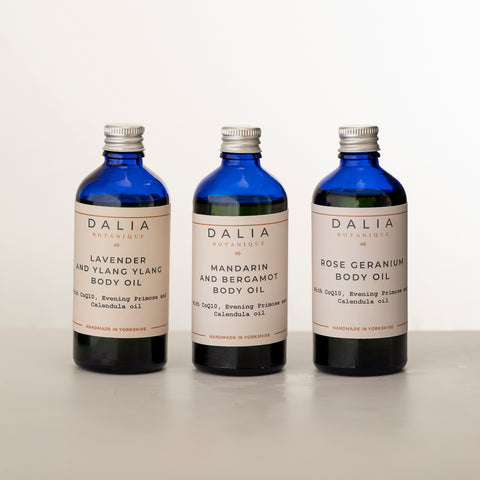 3 Body Oil oils in blue glass bottles