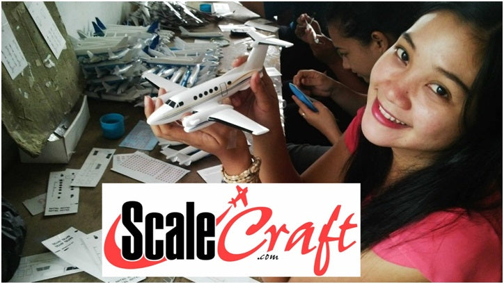 women making airplane models