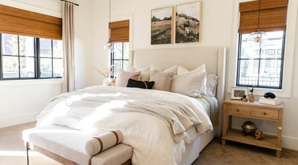 a soft and neutral color scheme defines a modern farmhouse bedroom