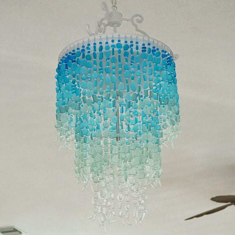 blue glass ombre lights enhance the home s beauty