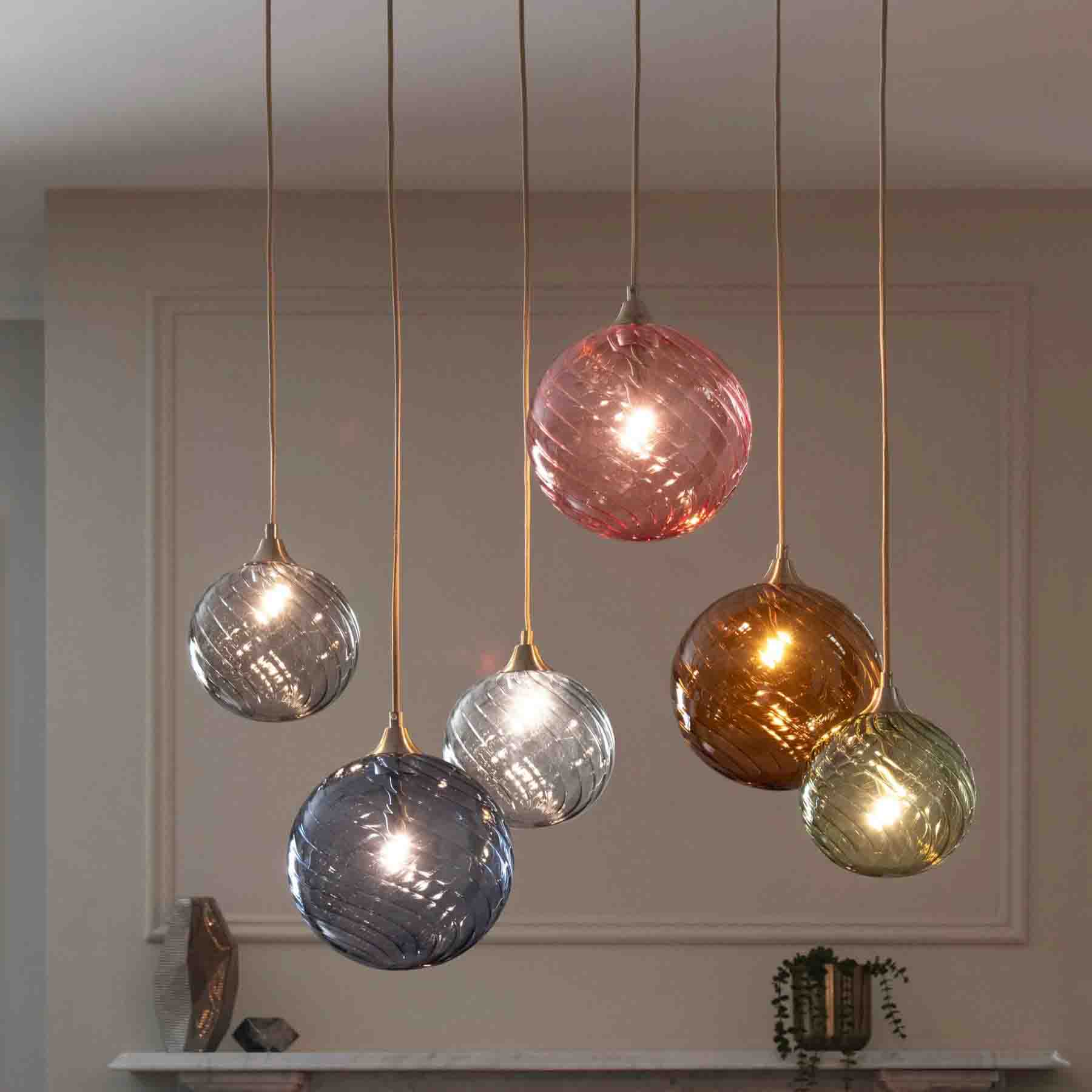 hanging in mid air these vibrant multicolored orbs define this light fixture essence