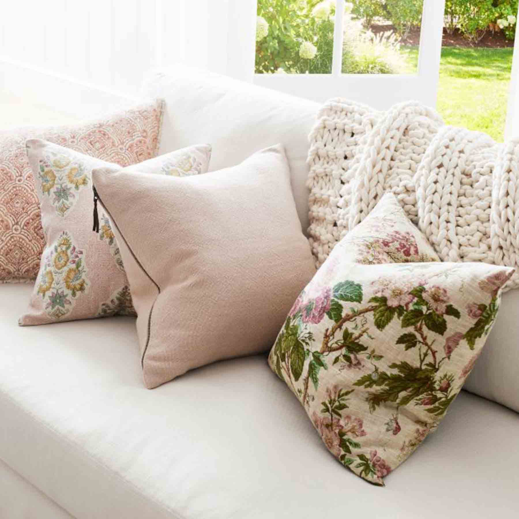 just adding a few floral cushions has already injected a fresh and lively ambiance into the room