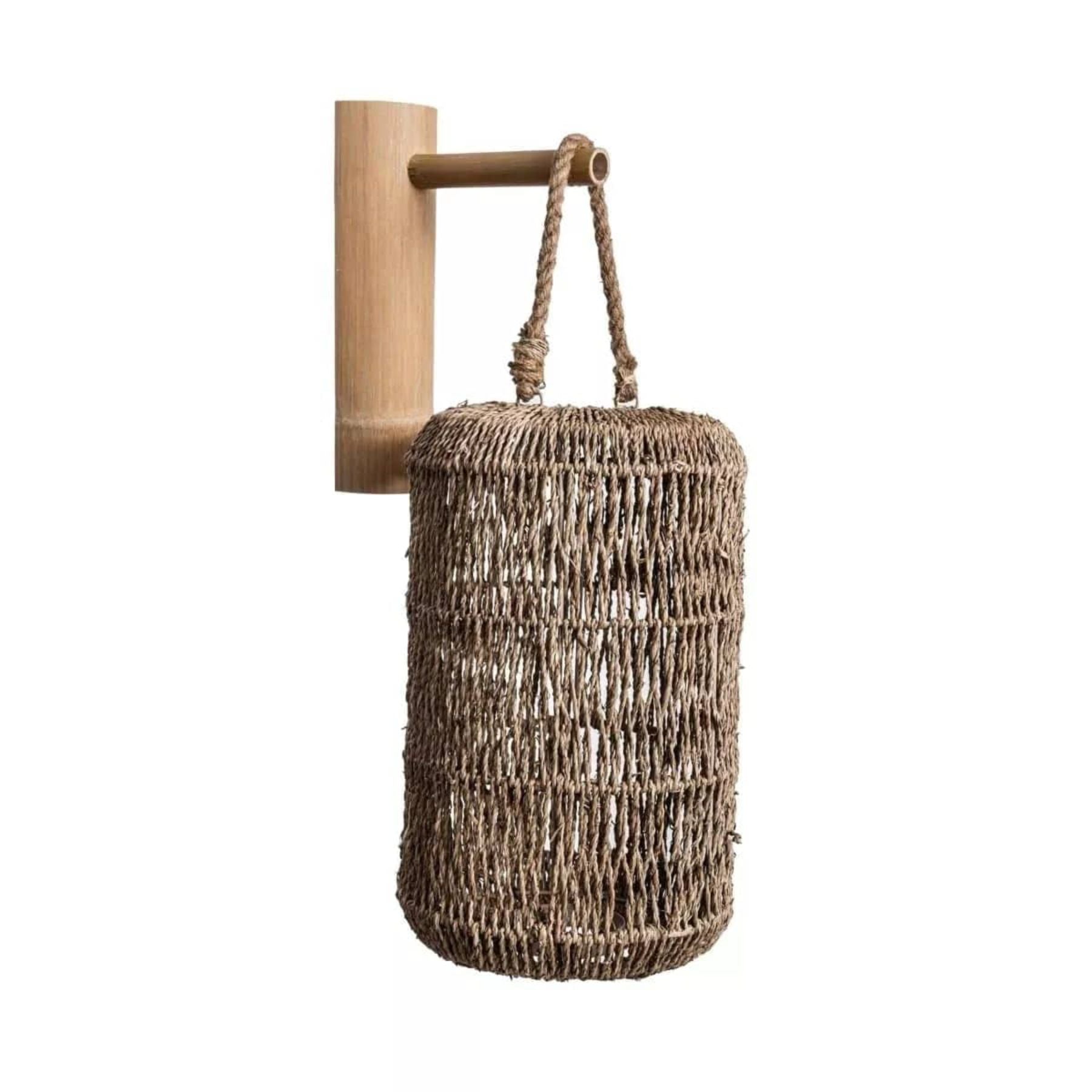 kai jute lantern lamps interwoven with the gentle charm of a loose weave gracefully enhance the aesthetics of any open garden