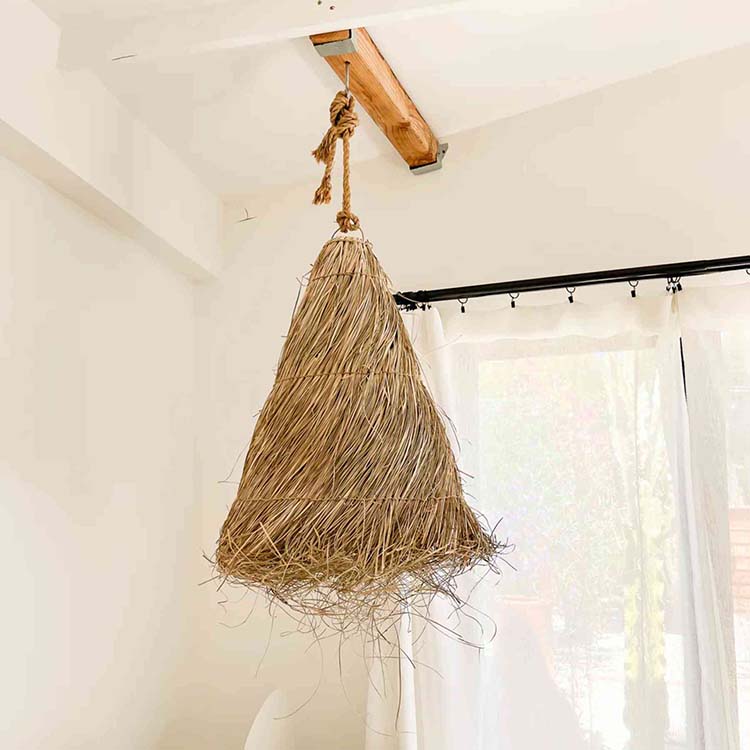 make the organic palm raffia pendant light the centerpiece of your decor