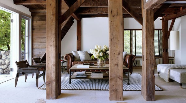 take advantage of rustic columns by incorporating wooden beams