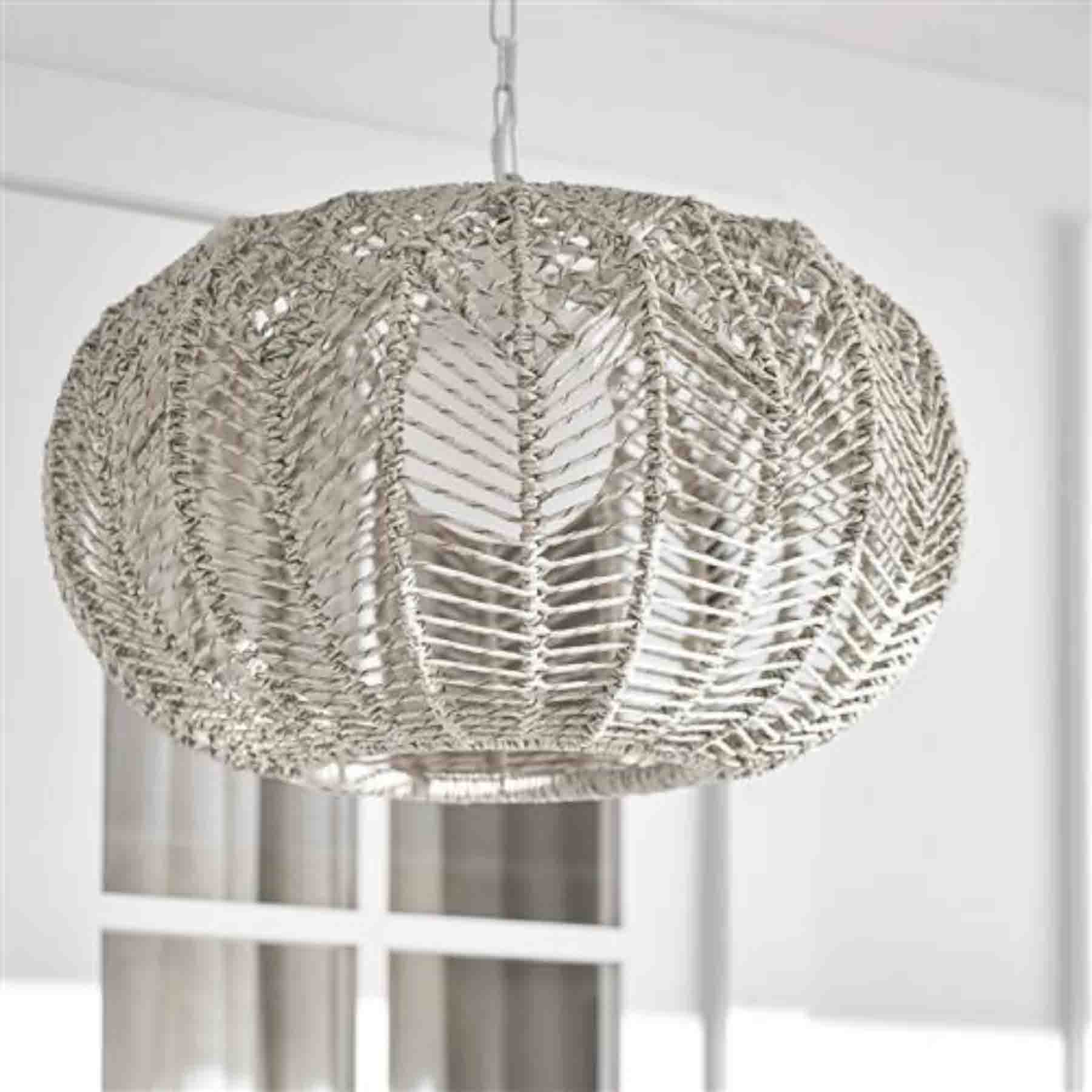 pendant lights made from synthetic rattan provide exceptional durability and resilience for outdoor use